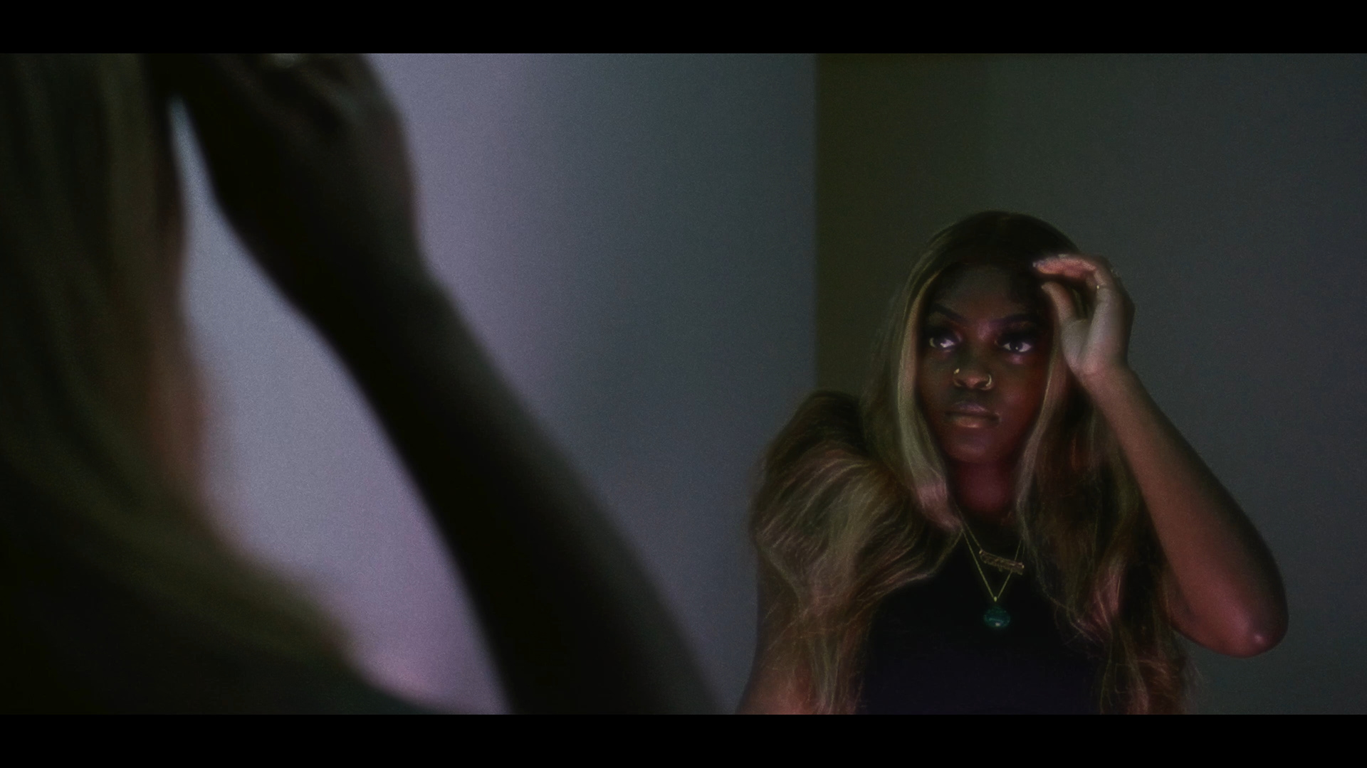 Moody indoor portfolio still with cinematic framing